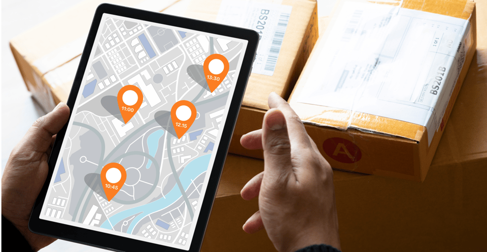 Hands holding a tablet with store pins on a map, things to consider when buying an order routing system