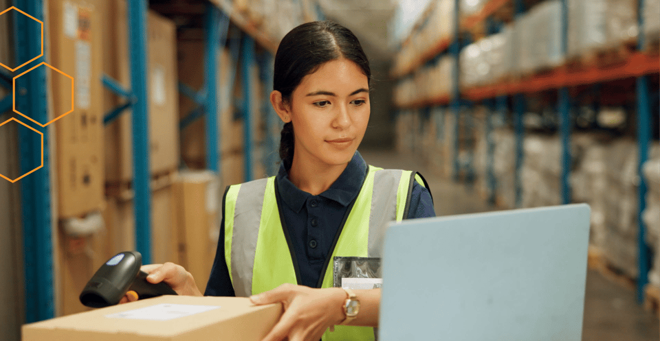 Associate scanning a box with a barcode scanner during an inventory cycle count in a stockroom